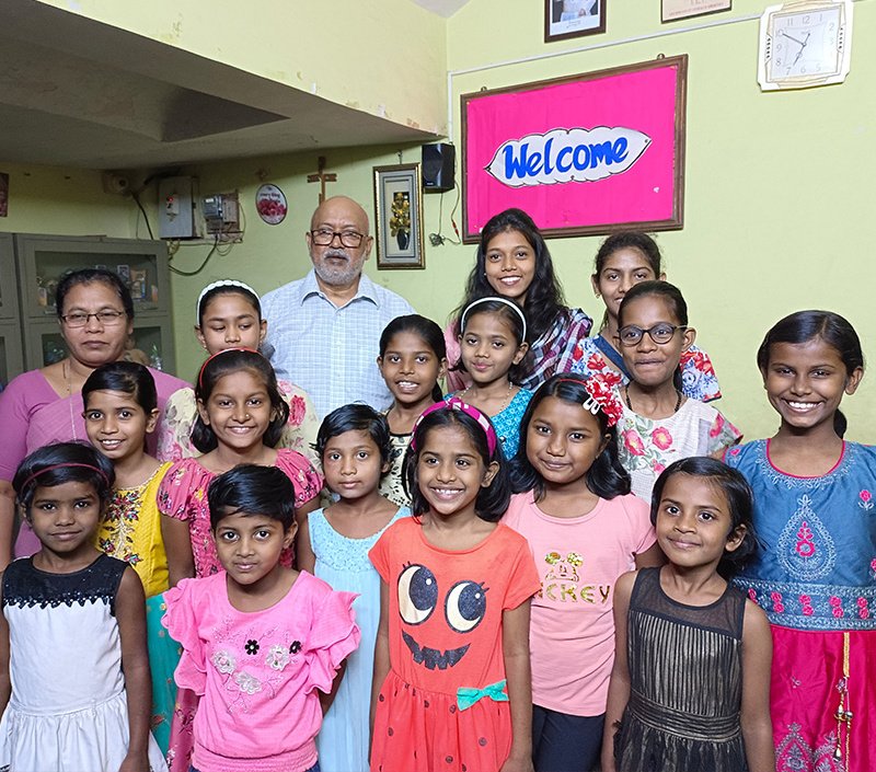 Fr. Francis Mulackal working with children